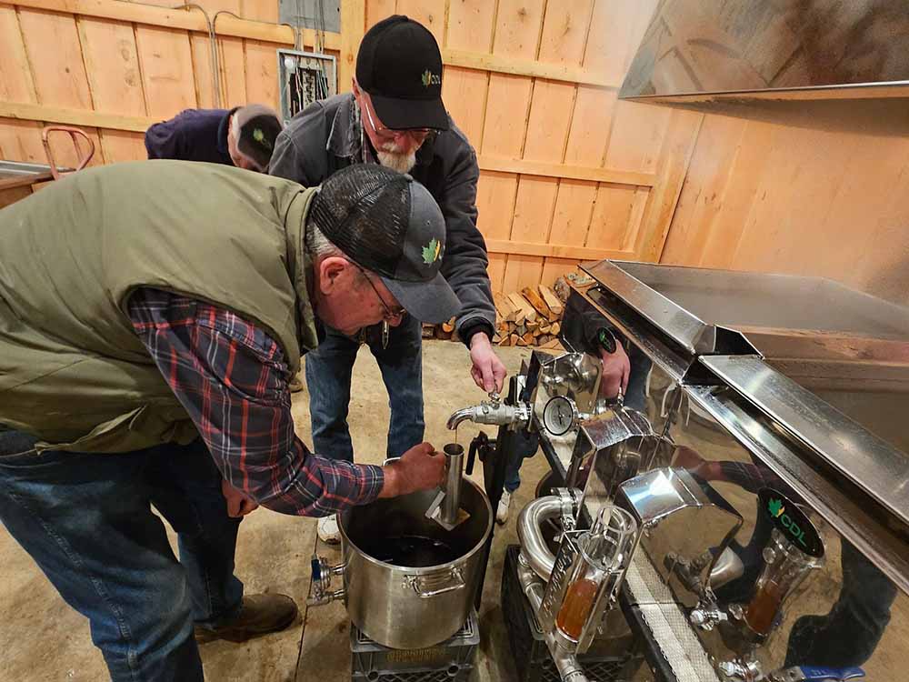 Working to filter the bigleaf maple syrup prior to bottling